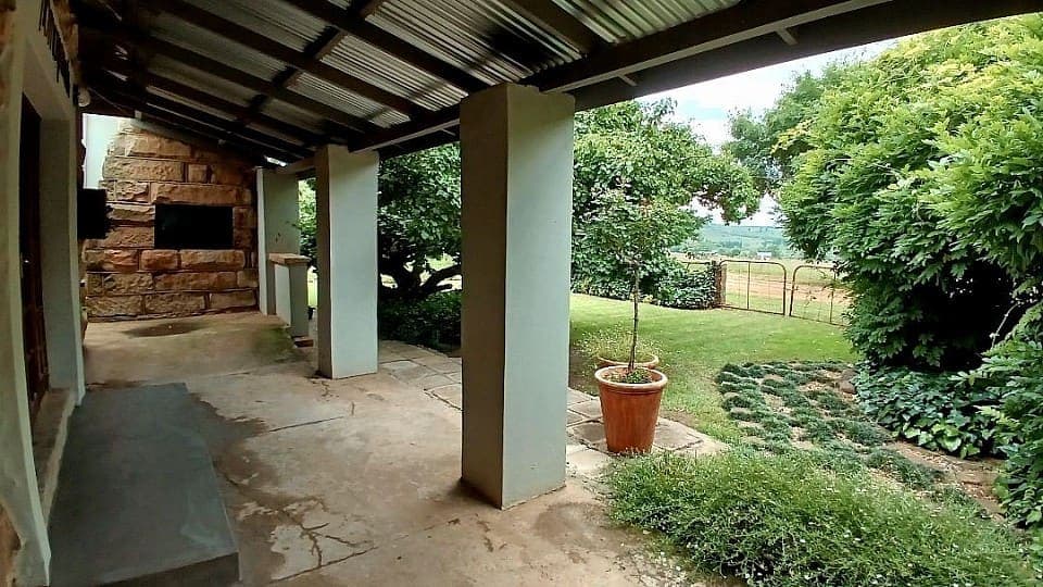 The veranda outside the function hall, looking over the garden to the fields beyond